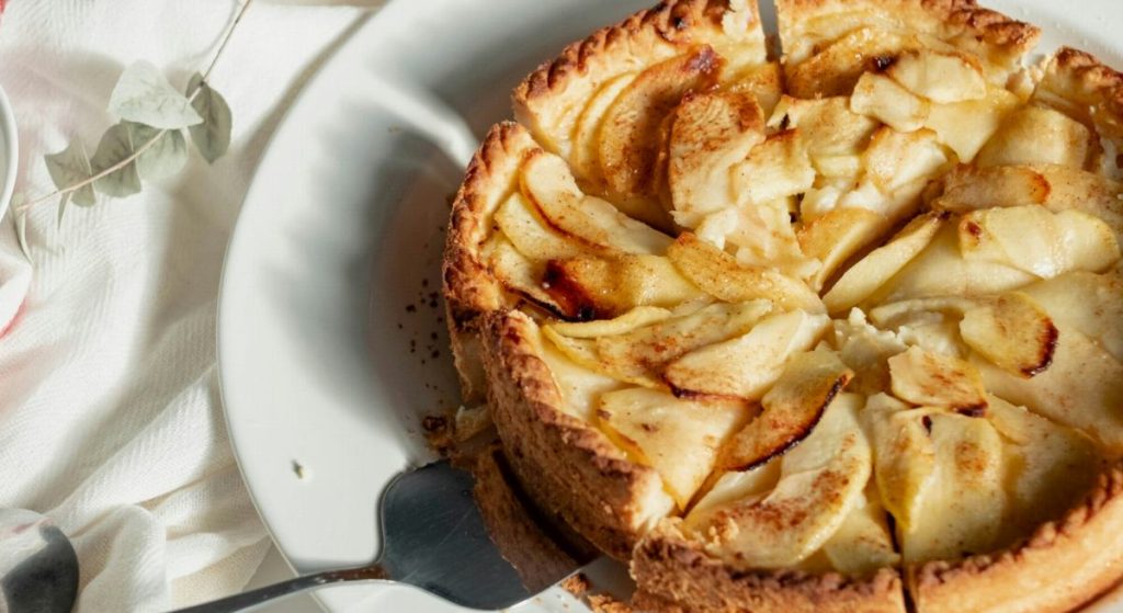 An apple tart on a white plate
