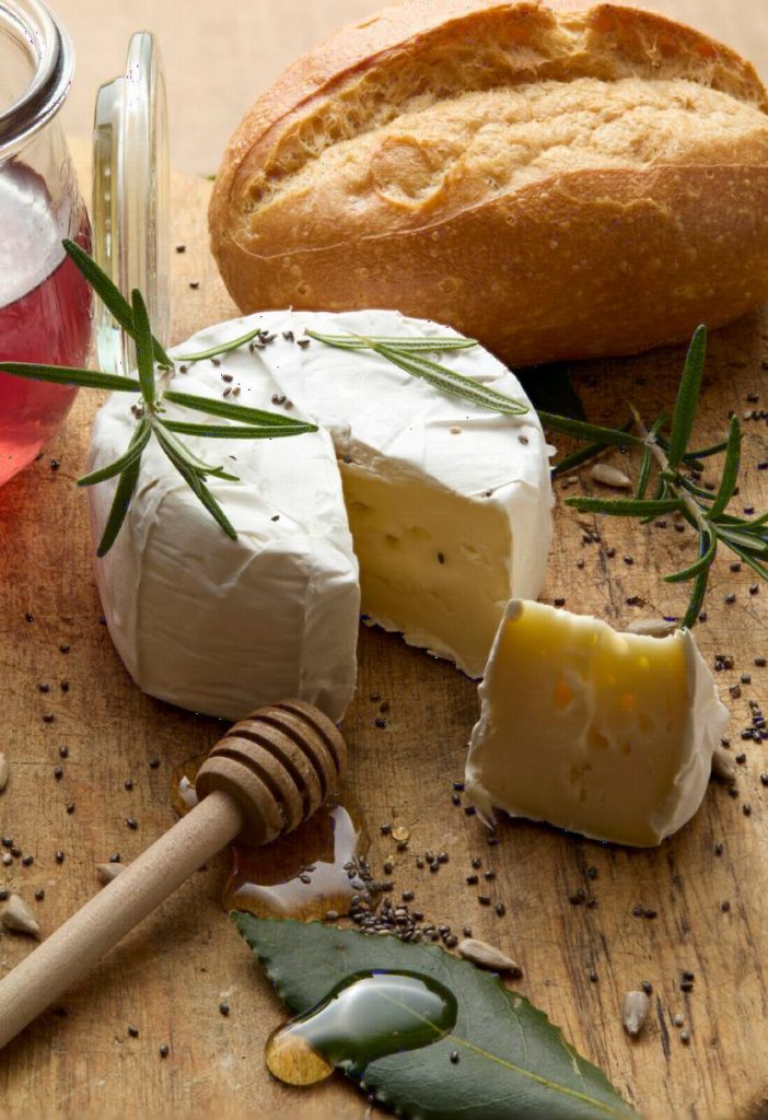 A soft cheese with bread and honey