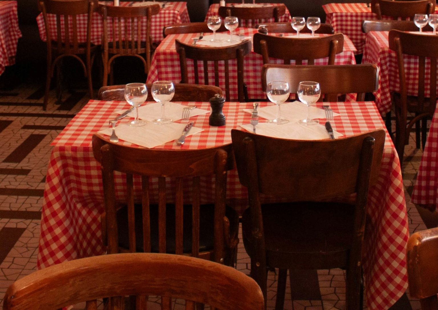 Checked tablecloths in an empty dining room
